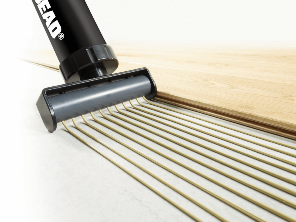 multiiiibead gun dispensing woodstikk 10 ms polymer wood flooring adhesive on cement based subfloor